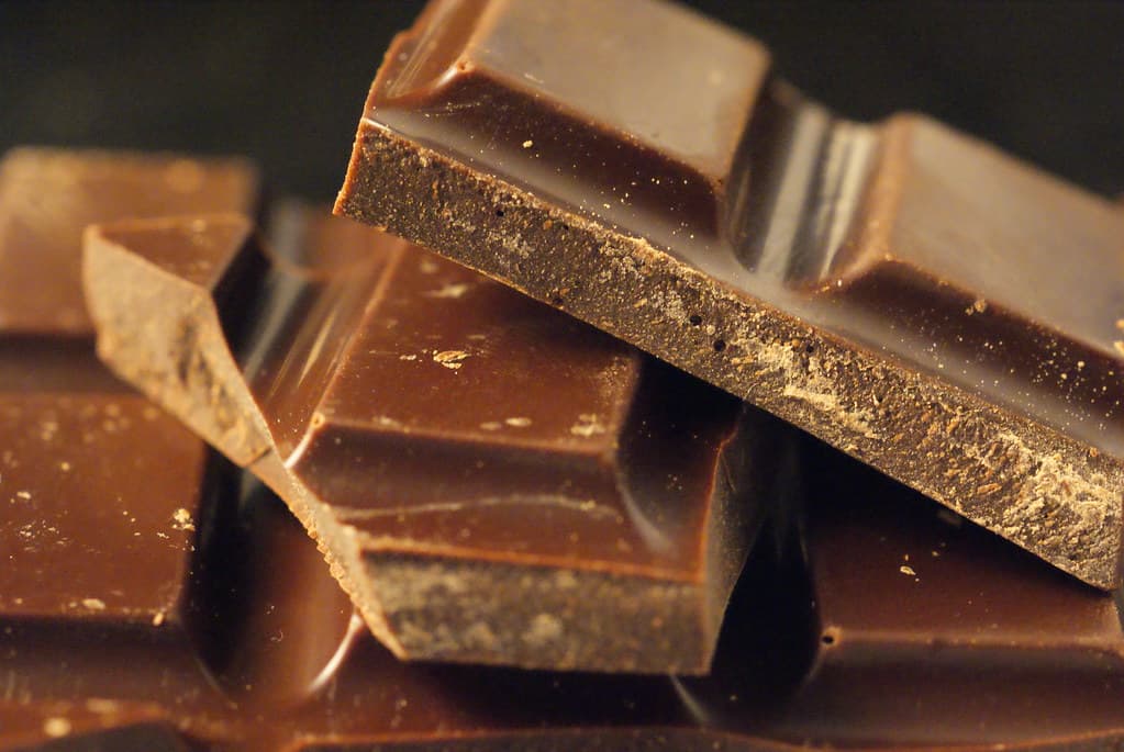 Close-up of stacked chocolate pieces.